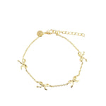 Loopette armband handgemaakt in Denemarken van 18k gold plating met gebogen design. Subtiel, speels en elegant.