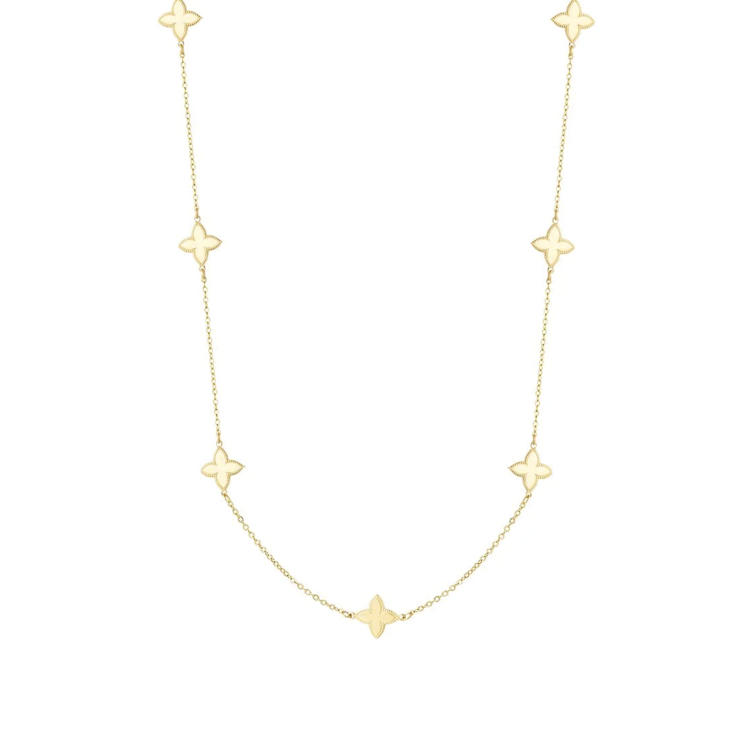 Verfijnde gouden ketting met kleine klaverbedels.